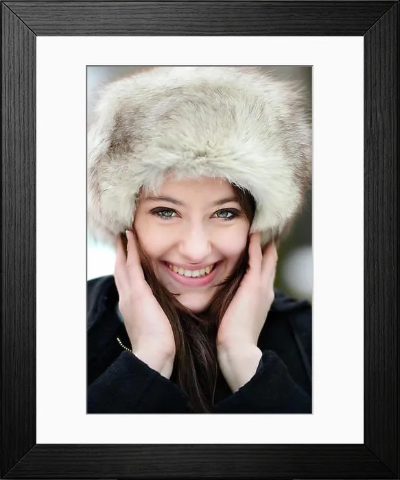 Framed Print : Smiling young woman wearing a fur hat, portrait Framed Print : Smiling young woman wearing a fur hat, portrait