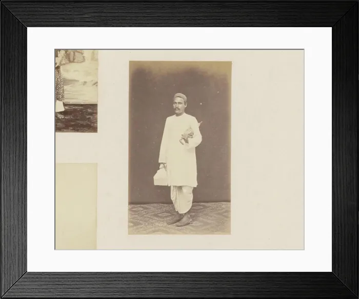 Framed Print : Portrait of an Indonesian man in a long robe with umbrella under the arm Framed Print : Portrait of an Indonesian man in a long robe with umbrella under the arm