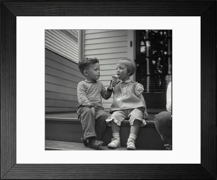 Framed Print : Vintage Photograph. Little boy sharing his ice cream cone with little girl. Frame 1
