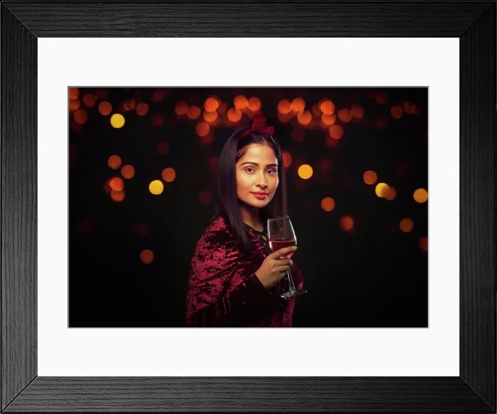 Framed Print : Beautiful woman holding a wine glass at a party Framed Print : Beautiful woman holding a wine glass at a party