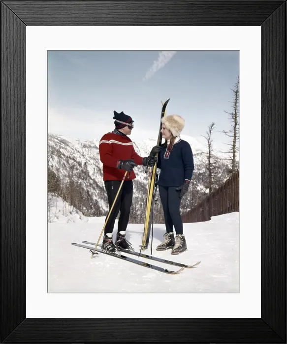 Framed Print : 1960s SMILING COUPLE MAN WOMAN TALKING ON MOUNTAIN SKI SLOPE WEARING SKI GEAR Framed Print : 1960s SMILING COUPLE MAN WOMAN TALKING ON MOUNTAIN SKI SLOPE WEARING SKI GEAR