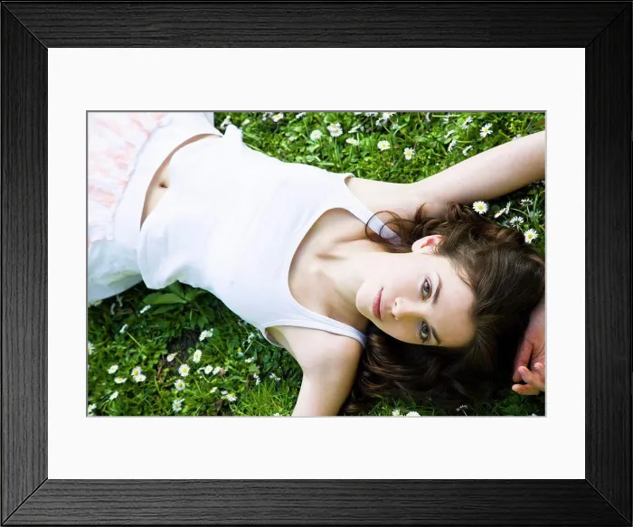 Framed Print : Woman laying on the grass