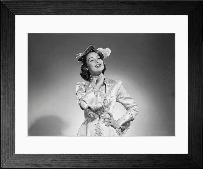 Framed Print : Vintage Photograph. Woman in long gown and feathered hat on white background. Frame 5 Framed Print : Vintage Photograph. Woman in long gown and feathered hat on white background. Frame 5