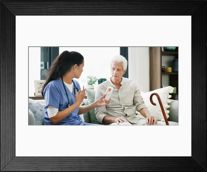 Framed Print : Nurse, pills and help with old man on sofa for medical treatment Framed Print : Nurse, pills and help with old man on sofa for medical treatment
