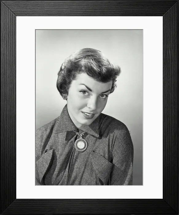 Framed Print : Vintage photograph. Woman with short hair looking up at camera Framed Print : Vintage photograph. Woman with short hair looking up at camera
