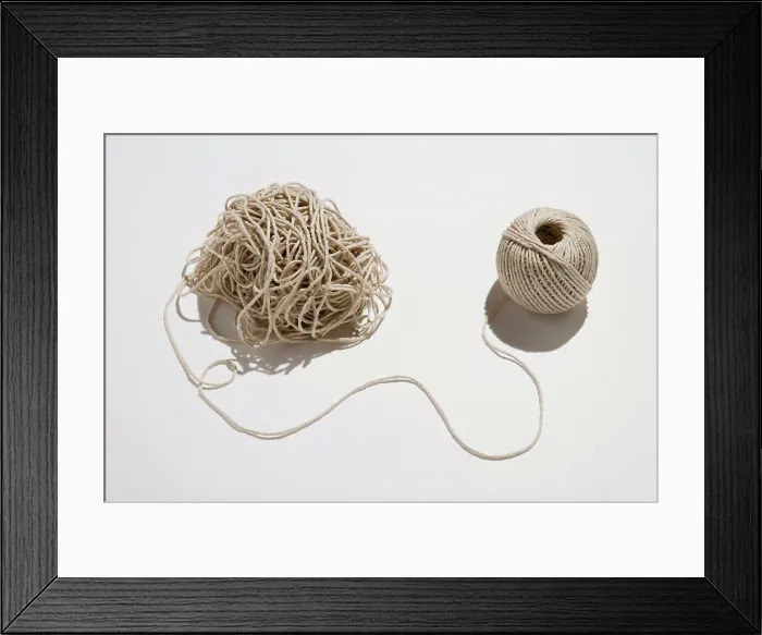 Framed Print : Ball of twine unraveling Framed Print : Ball of twine unraveling