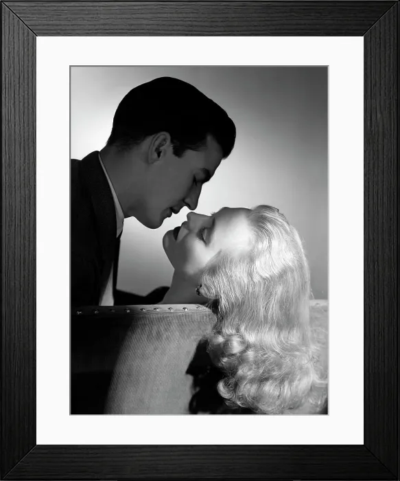 Framed Print : 1940S 1950S Movie Star Studio Style Romantic Couple Embracing On Sofa About To Kiss Husband Silhouette Wife Long Blond Framed Print : 1940S 1950S Movie Star Studio Style Romantic Couple Embracing On Sofa About To Kiss Husband Silhouette Wife Long Blond