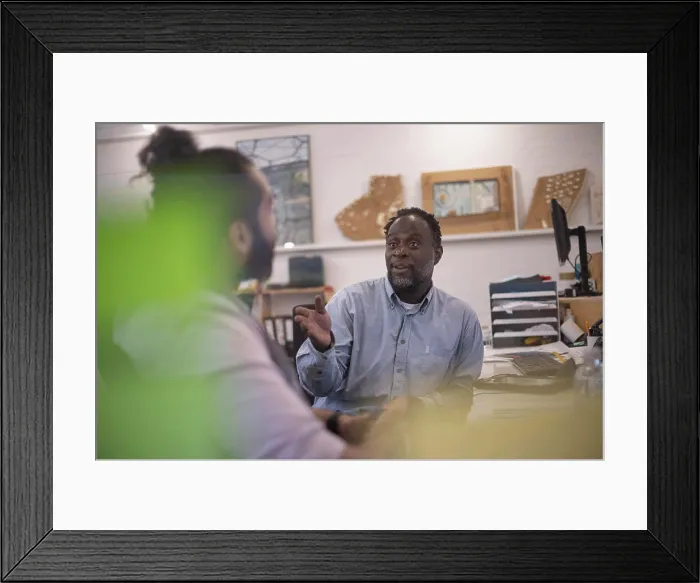Framed Print : Businessmen talking in office