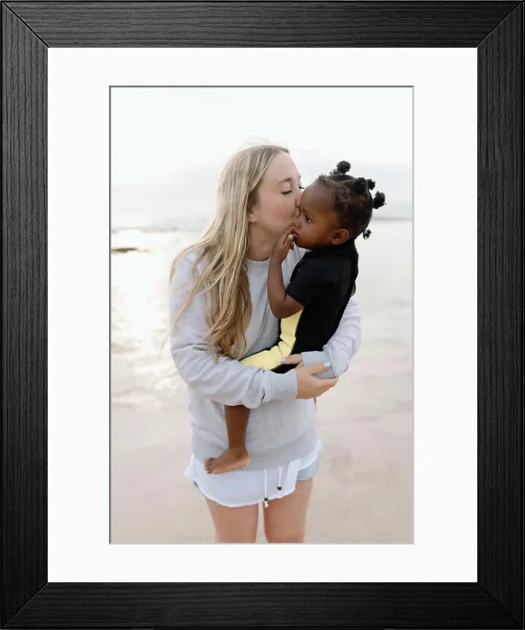 Framed Print : Mother kissing her adopted daughter