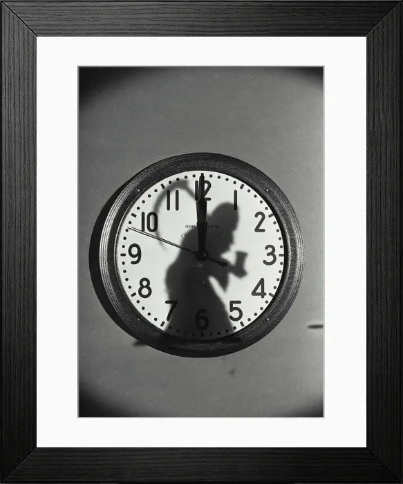 Framed Print : Vintage Photograph. Wall mounted clock face with Father Time shadow on front Framed Print : Vintage Photograph. Wall mounted clock face with Father Time shadow on front