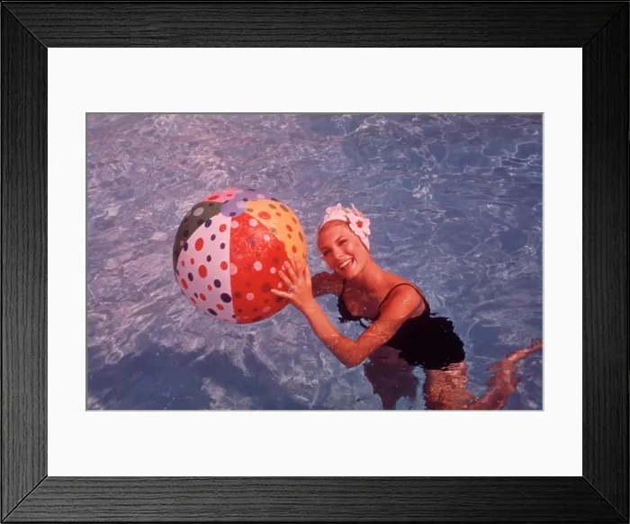 Framed Print : 1960S Woman In Swimming Pool Holding Beach Ball Framed Print : 1960S Woman In Swimming Pool Holding Beach Ball