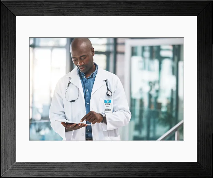 Framed Print : Doctor with tablet, happy reading social media post