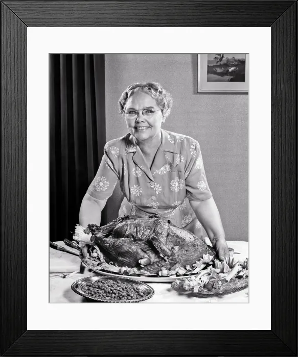 Framed Print : 1950s SENIOR WOMAN LOOKING AT CAMERA PLACING LARGE THANKSGIVING TURKEY ON THE DINING TABLE WITH BOWL PEAS AND CELERY Framed Print : 1950s SENIOR WOMAN LOOKING AT CAMERA PLACING LARGE THANKSGIVING TURKEY ON THE DINING TABLE WITH BOWL PEAS AND CELERY