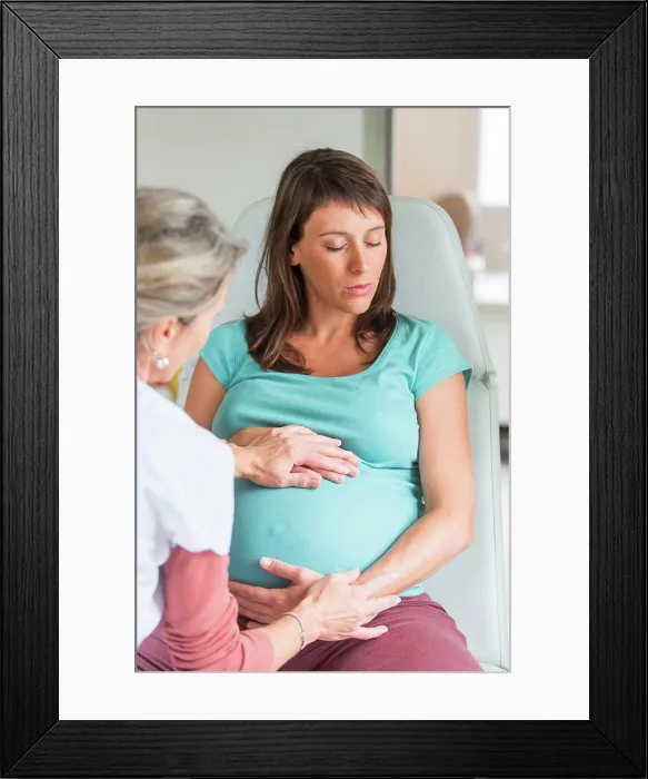 Framed Print : Obstetric examination