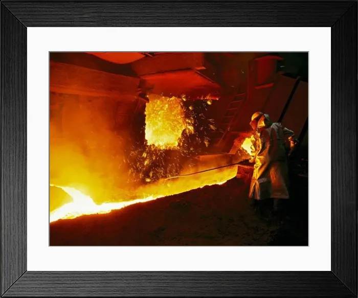 Framed Print : A steel worker takes a sample from a blast furnace Framed Print : A steel worker takes a sample from a blast furnace