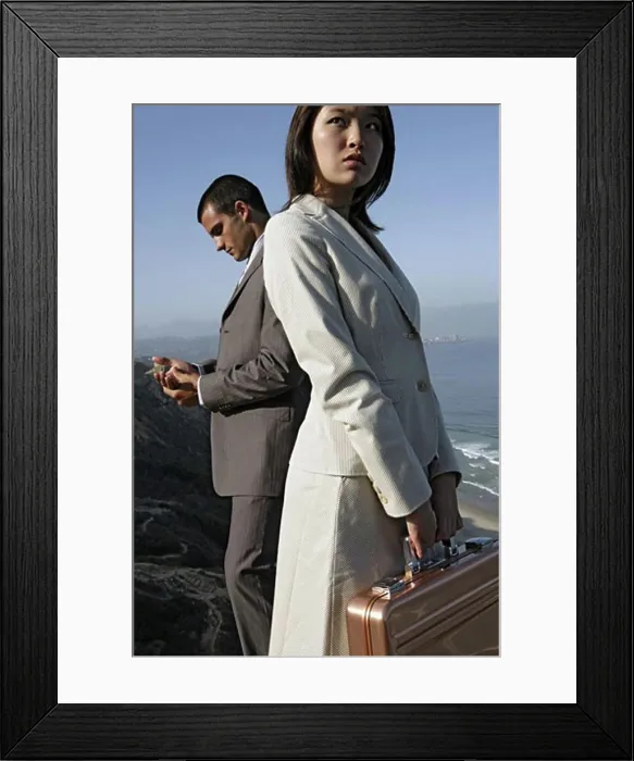 Framed Print : View of a man and a woman standing on a cliff Framed Print : View of a man and a woman standing on a cliff