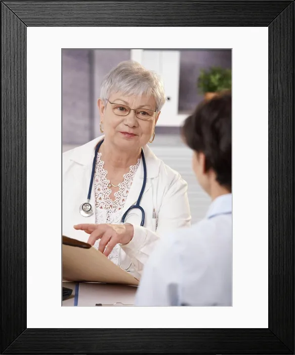 Framed Print : Doctor explaining to patient Smiling senior doctor explaining results to patient in office Framed Print : Doctor explaining to patient Smiling senior doctor explaining results to patient in office