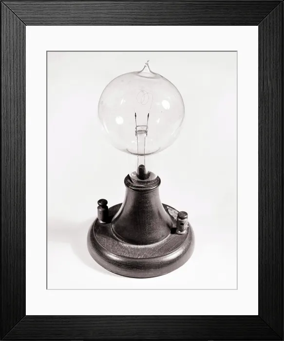 Framed Print : 1800s 1877 REPLICA FIRST THOMAS A EDISON INCANDESCENT CARBON FILAMENT LAMP LIGHT BULB Framed Print : 1800s 1877 REPLICA FIRST THOMAS A EDISON INCANDESCENT CARBON FILAMENT LAMP LIGHT BULB