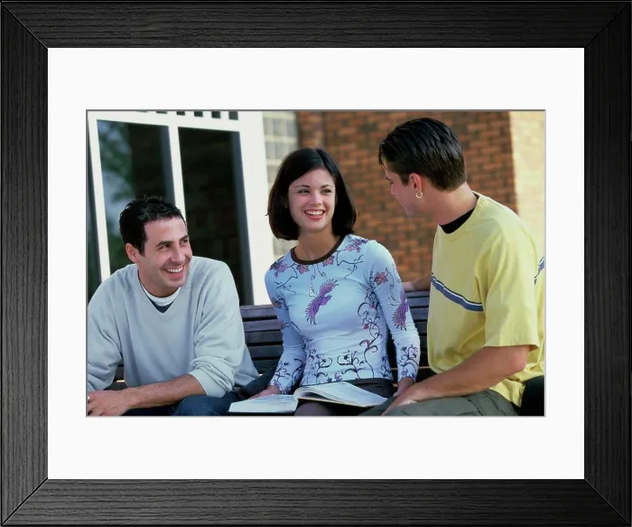 Framed Print : Three teenagers talking to each other Framed Print : Three teenagers talking to each other