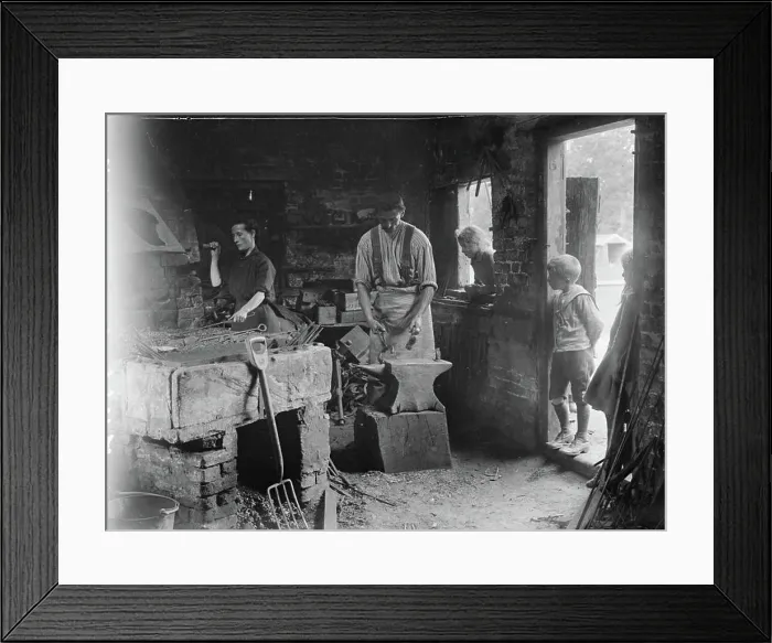 Framed Print : Ministry of Information First World War Official Collection Woman helping her blacksmith husband in his forge