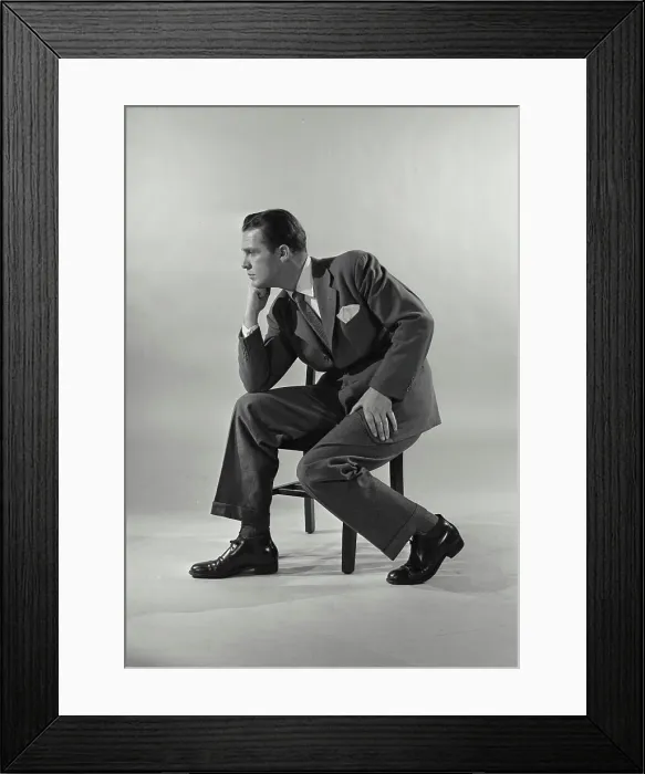 Framed Print : Vintage Photograph. Man in suit sittin gon chair with chin rested on fist