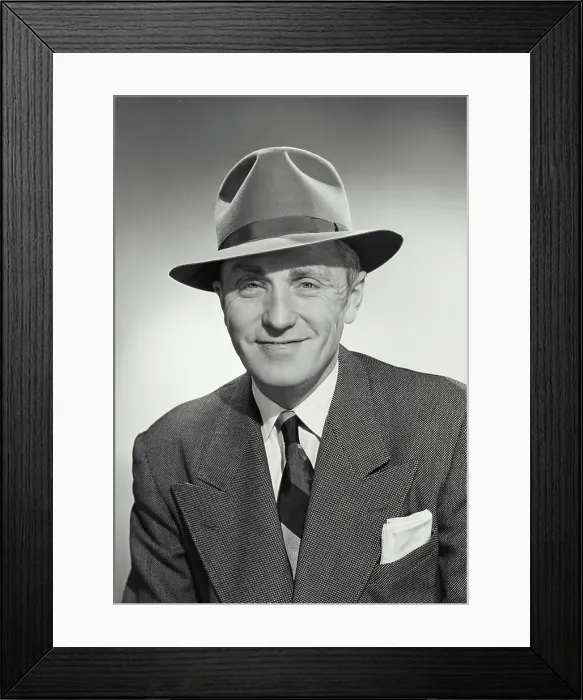 Framed Print : Vintage photograph. Man in suit and tie wearing hat and smiling at camera Framed Print : Vintage photograph. Man in suit and tie wearing hat and smiling at camera