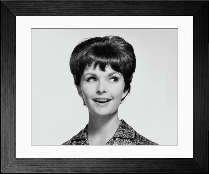 Framed Print : Close-up of a young woman smiling Framed Print : Close-up of a young woman smiling
