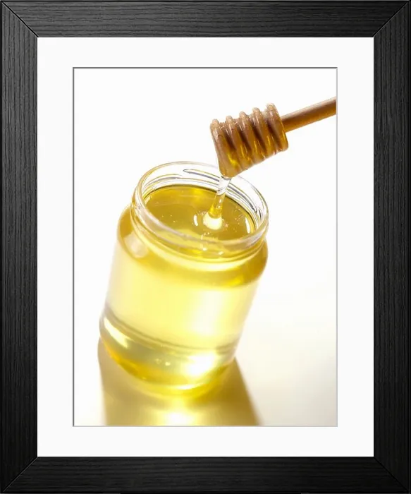 Framed Print : Stirrer in jar of honey Framed Print : Stirrer in jar of honey