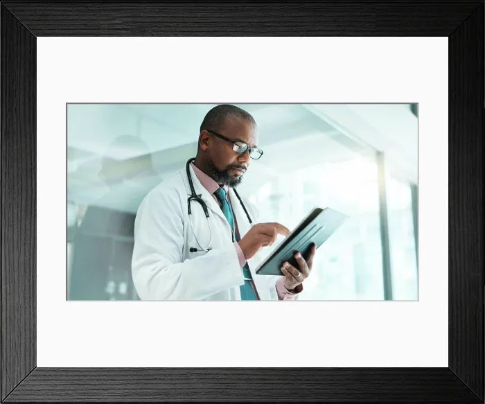 Framed Print : Black man, doctor and tablet for healthcare in hospital with medical research Framed Print : Black man, doctor and tablet for healthcare in hospital with medical research