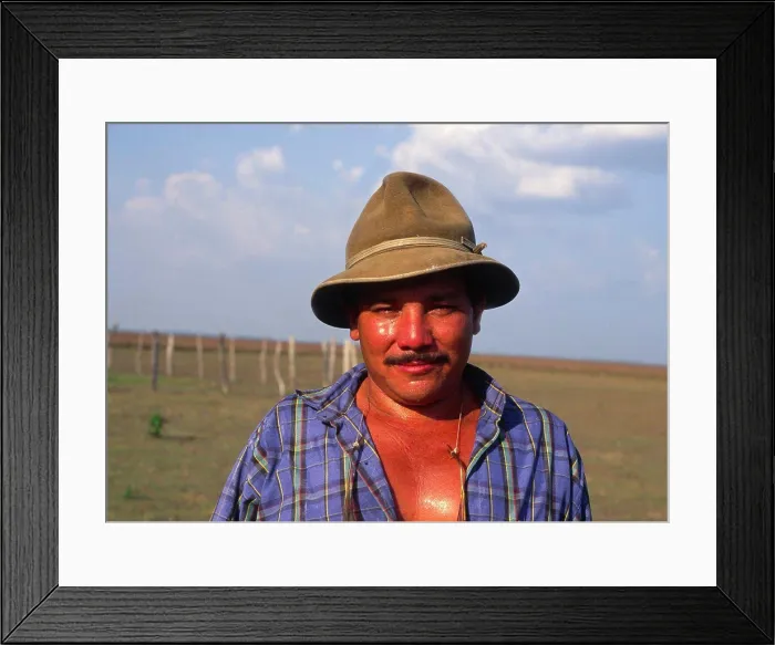 Framed Print : Colombia, Casanare, Llanero Cowboy Wearing A Hat And Standing In A Field Framed Print : Colombia, Casanare, Llanero Cowboy Wearing A Hat And Standing In A Field