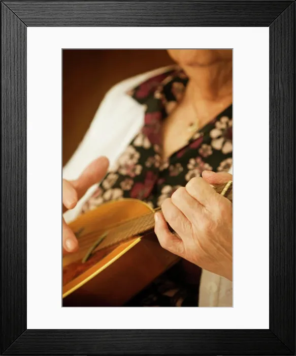 Framed Print : Elderly Woman Playing A Mandolin