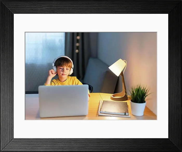 Framed Print : Child home taking virtual courses
