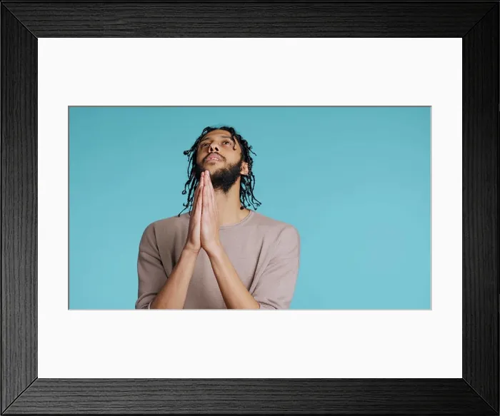 Framed Print : Pious Middle Eastern man praying to his god Framed Print : Pious Middle Eastern man praying to his god