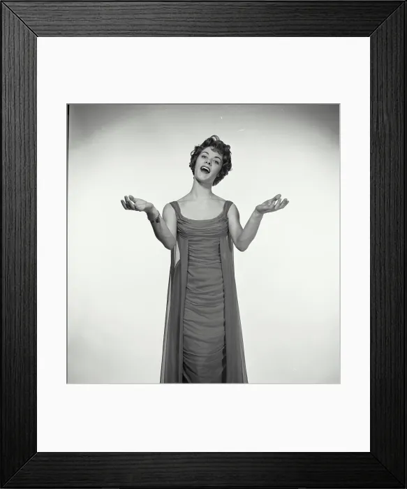 Framed Print : Vintage Photograph. Woman in studio portrait sings while she has her hands with palms up to her sides Framed Print : Vintage Photograph. Woman in studio portrait sings while she has her hands with palms up to her sides
