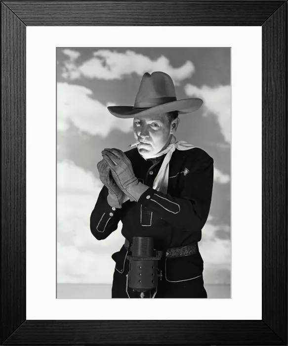 Framed Print : Vintage Photograph. Man in cowboy outfit with hat and gloves smoking cigarette Framed Print : Vintage Photograph. Man in cowboy outfit with hat and gloves smoking cigarette