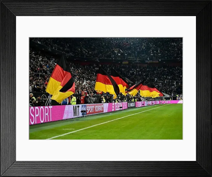 Framed Print : Atmospheric flag wavers with German flag in front of the start of the football match Framed Print : Atmospheric flag wavers with German flag in front of the start of the football match