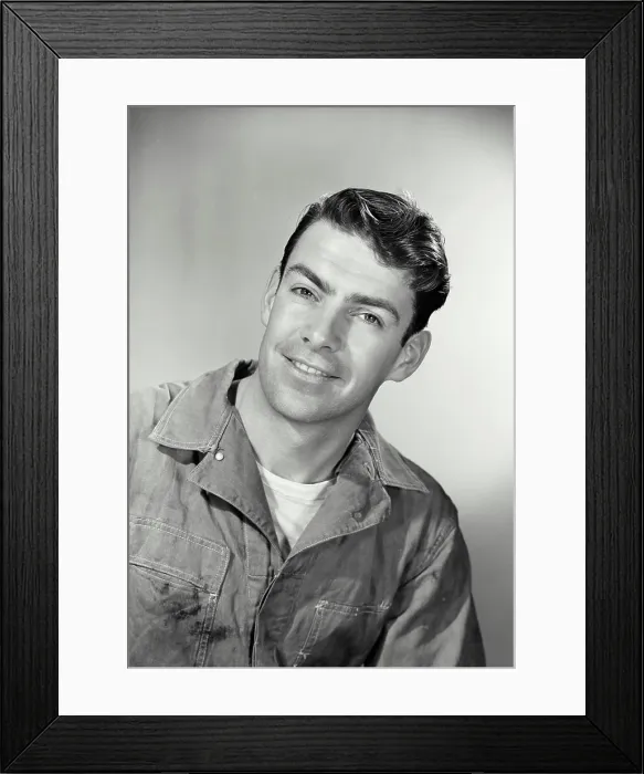 Framed Print : Vintage photograph. Workingman and dirty clothes looking at camera