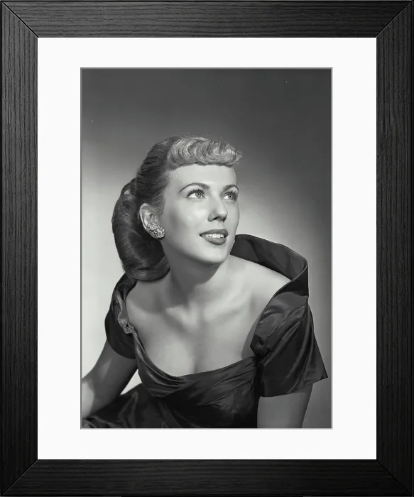 Framed Print : Vintage photograph. Woman in elegant dress smiling off camera Framed Print : Vintage photograph. Woman in elegant dress smiling off camera