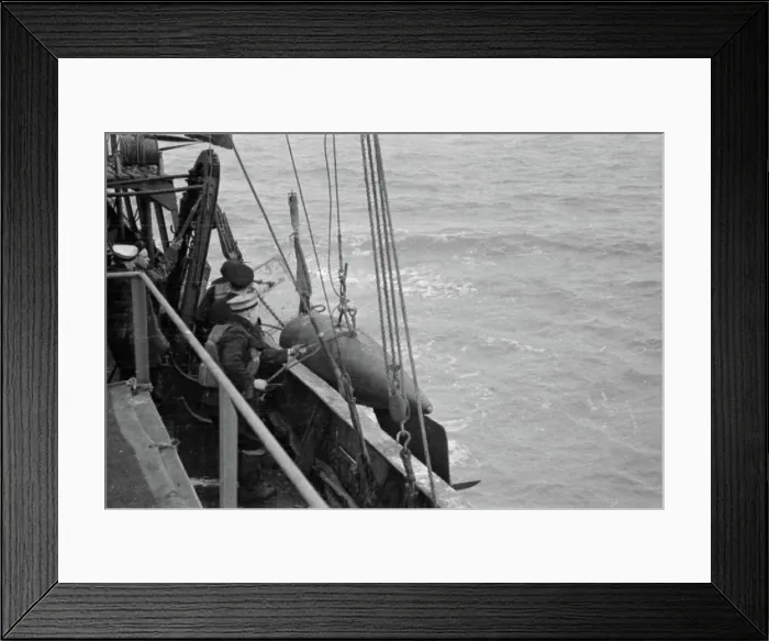 Framed Print : The Royal Navy during the Second World War The orepesa float on board a minesweeper being hoisted overboard Framed Print : The Royal Navy during the Second World War The orepesa float on board a minesweeper being hoisted overboard