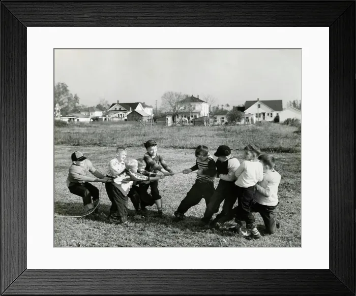 Framed Print : Boys pulling rope on field Framed Print : Boys pulling rope on field
