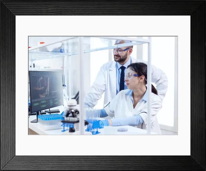 Framed Print : Two scientists are working together in laboratory Framed Print : Two scientists are working together in laboratory