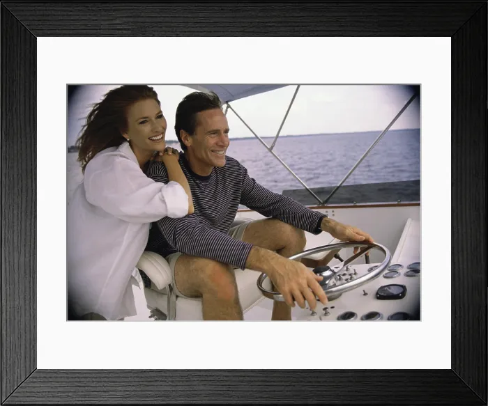 Framed Print : Mid adult couple on a boat Framed Print : Mid adult couple on a boat