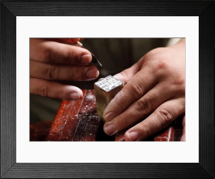 Framed Print : Craftsman carving Chinese character into a Chinese chop Framed Print : Craftsman carving Chinese character into a Chinese chop