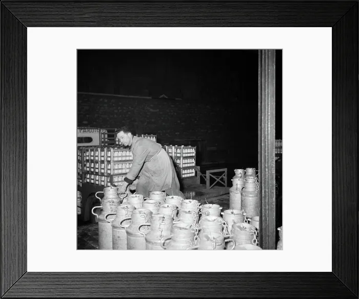Framed Print : Poll photo collection. Report Paris. Milk factory: Man dragged the milk buses. 1950. France, Paris Framed Print : Poll photo collection. Report Paris. Milk factory: Man dragged the milk buses. 1950. France, Paris
