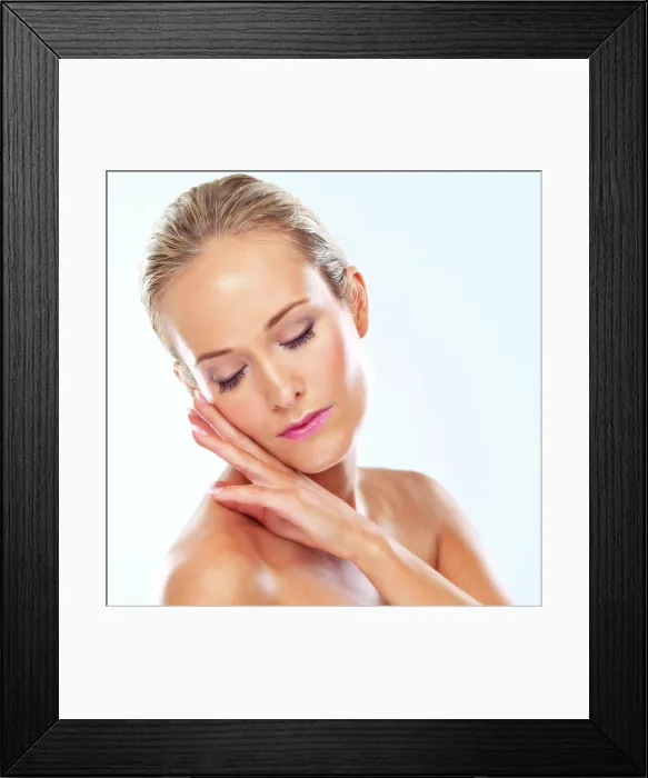 Framed Print : Soft, makeup and calm woman with hands on face in studio for wellness Framed Print : Soft, makeup and calm woman with hands on face in studio for wellness