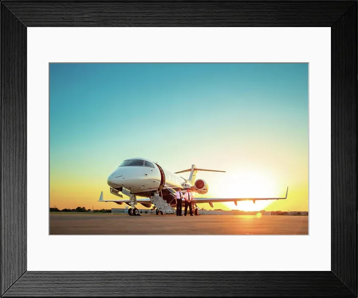 Framed Print : Two Pilots standing next to Jet on tarmac of small airport at sunset Framed Print : Two Pilots standing next to Jet on tarmac of small airport at sunset