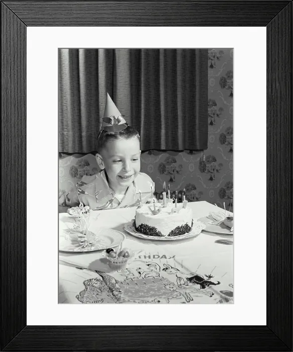 Framed Print : Boy sitting in front of a birthday cake