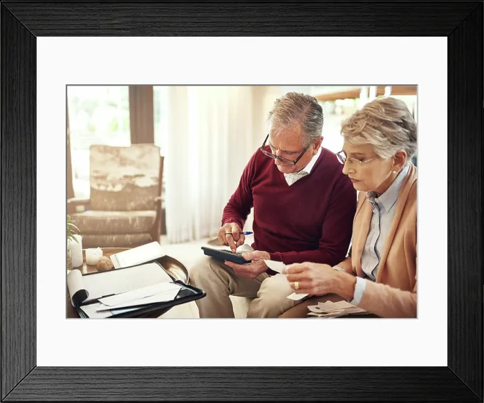 Framed Print : Finance, calculator and budget with an old couple in their home for retirement or pension planning Framed Print : Finance, calculator and budget with an old couple in their home for retirement or pension planning