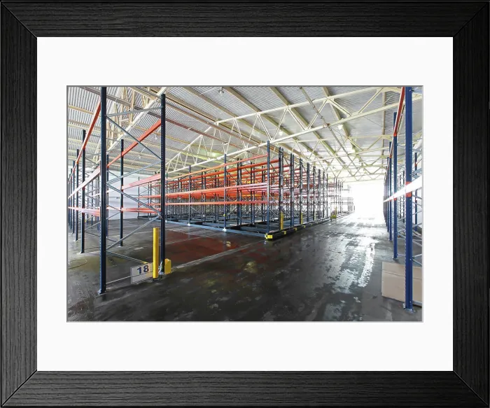 Framed Print : Distribution warehouse Mobile roller shelving system in distribution warehouse Framed Print : Distribution warehouse Mobile roller shelving system in distribution warehouse