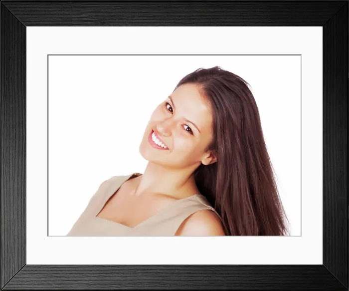 Framed Print : Portrait of one smiling beautiful woman isolated against white with copyspace in a studio Framed Print : Portrait of one smiling beautiful woman isolated against white with copyspace in a studio